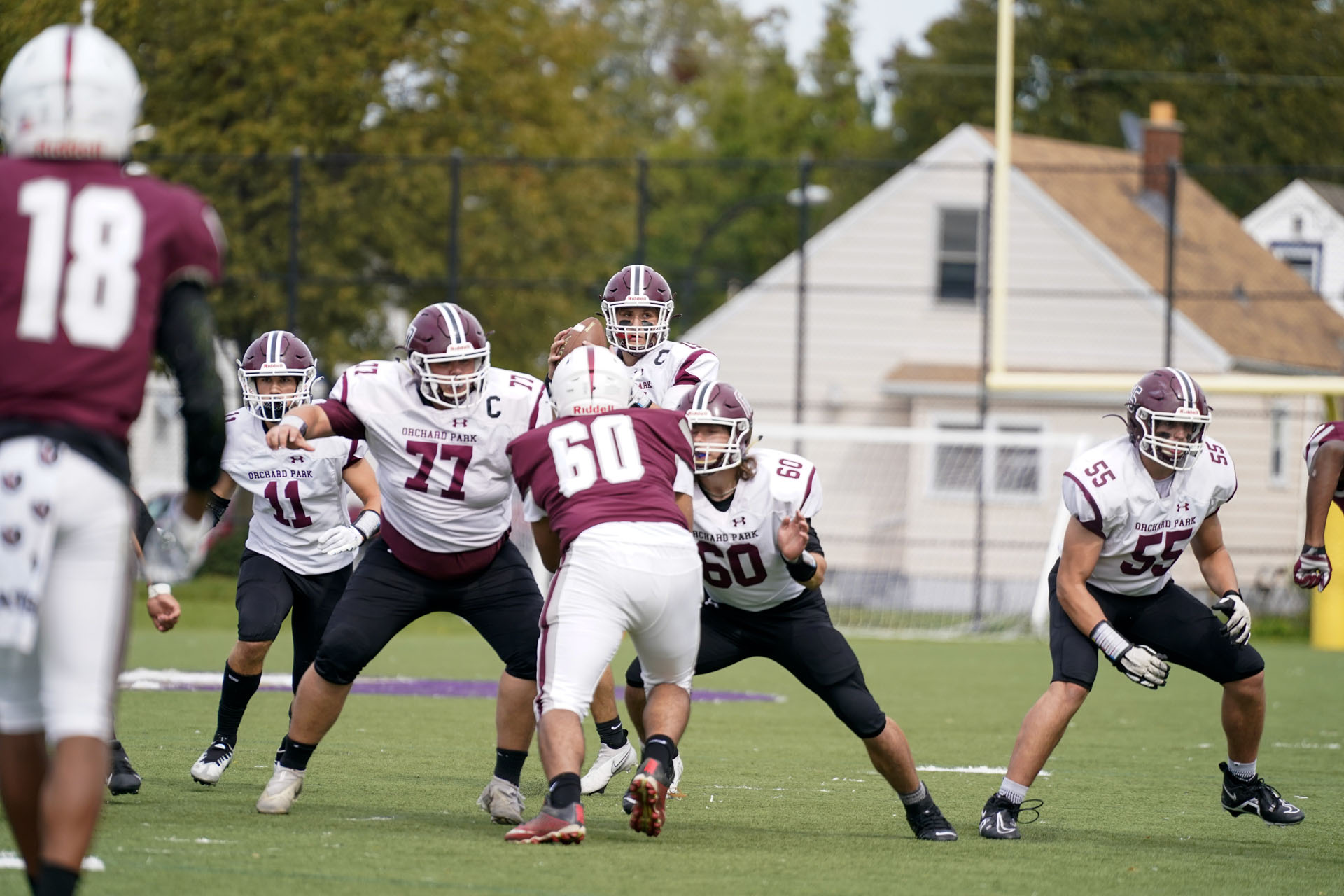 The Orchard Park offense running their play