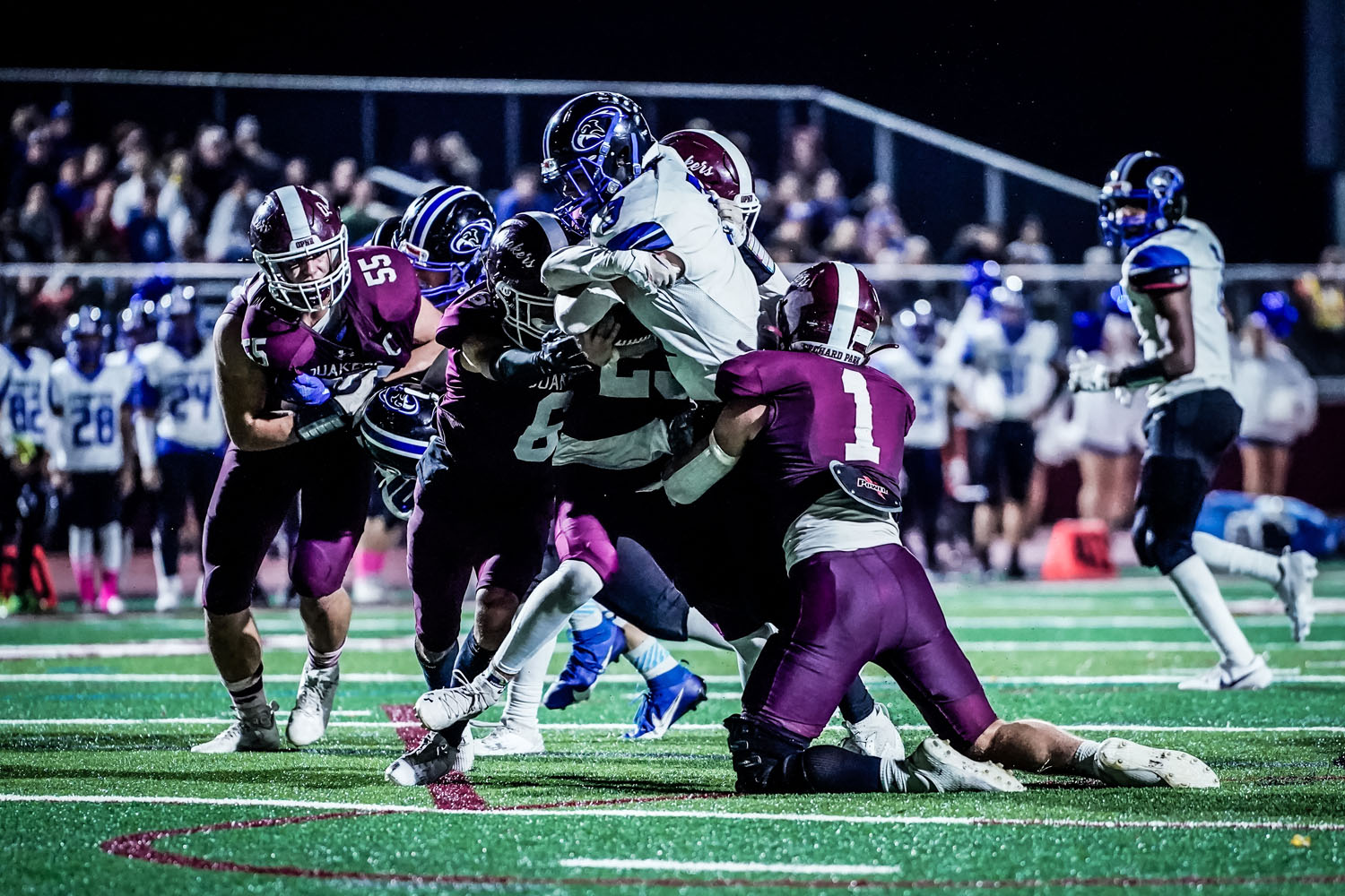 Quakers making the tackle
