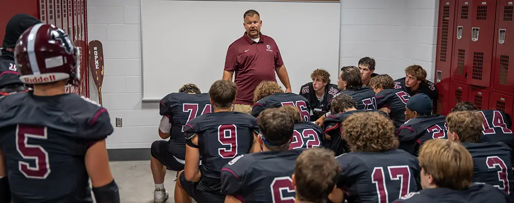 Coach speaking to the team before the game